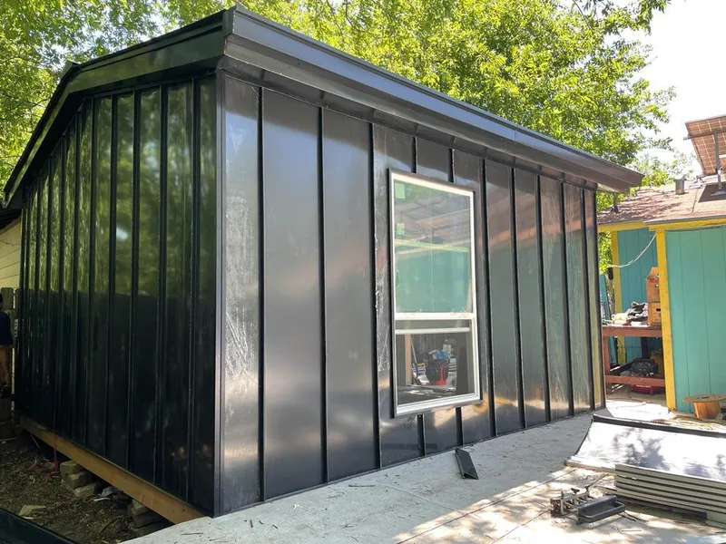 Black standing seam metal wall panels for Metal Roof Installation in Graham